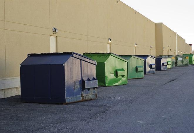 large construction waste containers in a row at a job site in Bell